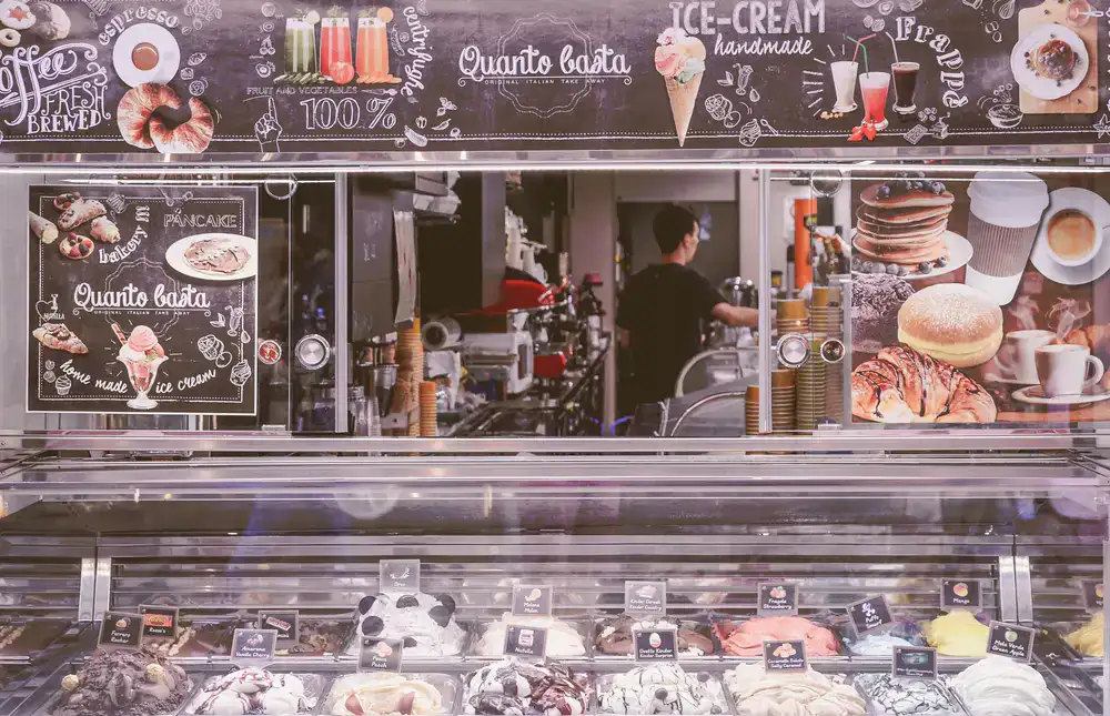 Display case filled with artisan treats at Nuvola Gelato