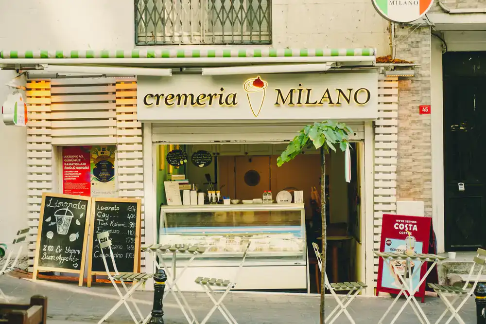 The welcoming storefront of Nuvola Gelato on a sunny day